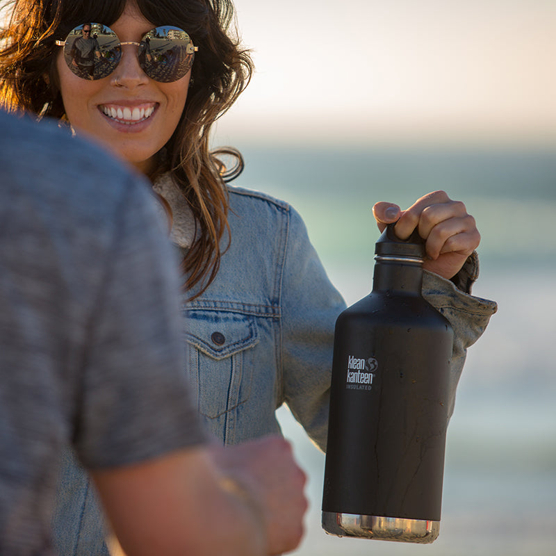 64oz-classic-with-loop-cap-g6 64oz_insulated_classic_black_beach_girl_hand_square.jpg
