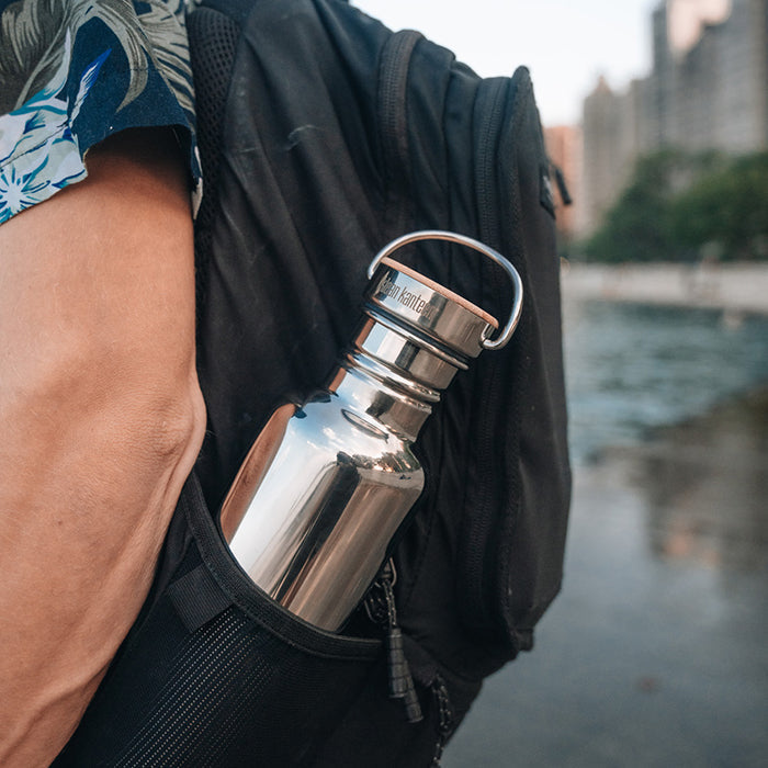 27oz-reflect-with-bamboo-cap-f1 K27SSLRF-MS-BAMBOO_reflect-bottle_backpack_lifestyle.jpg